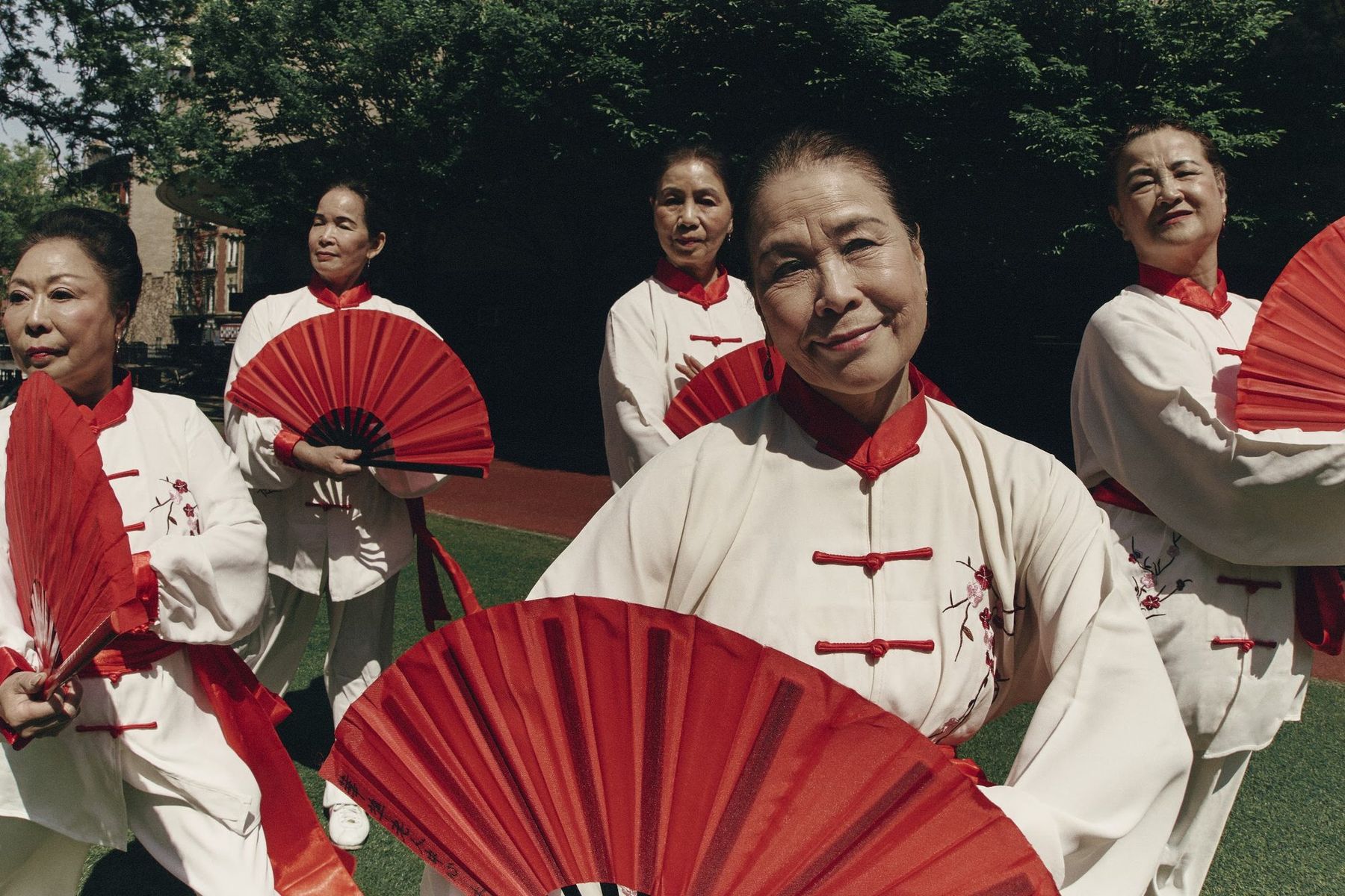 SLOW DAWN: elders with red fans